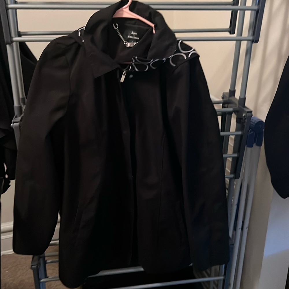 Black raincoat with water repellent material